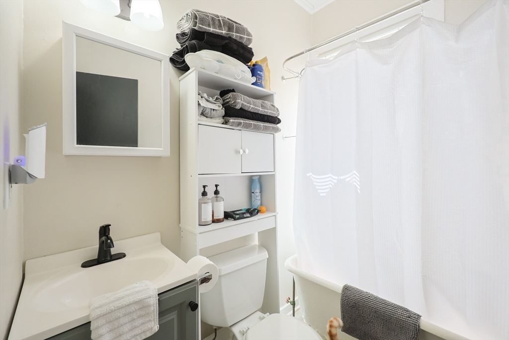 104 Grove Street Fall River, MA 02720 - Photo 14 of 37 a bathroom with a sink toilet and mirror