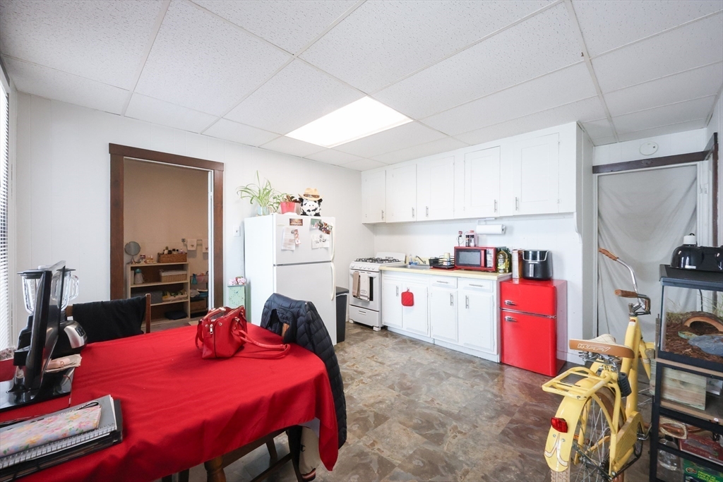104 Grove Street Fall River, MA 02720 - Photo 15 of 37 a view of a kitchen with dining table and chairs