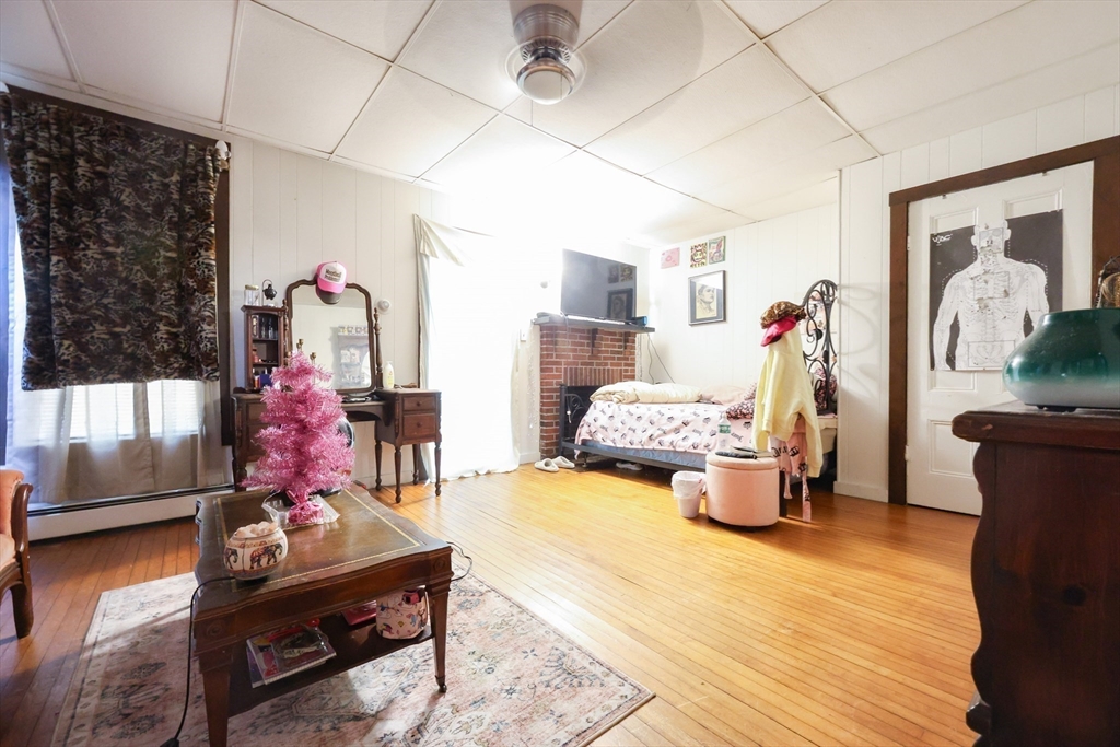 104 Grove Street Fall River, MA 02720 - Photo 16 of 37 a bedroom with furniture and a bed