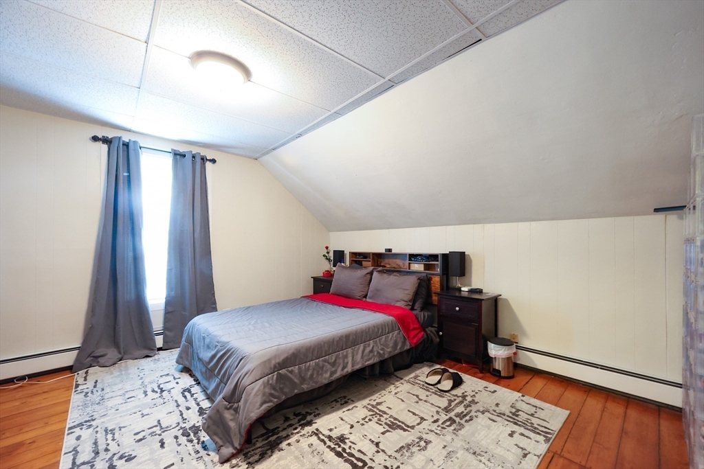 104 Grove Street Fall River, MA 02720 - Photo 21 of 37 a bedroom with a bed and a window