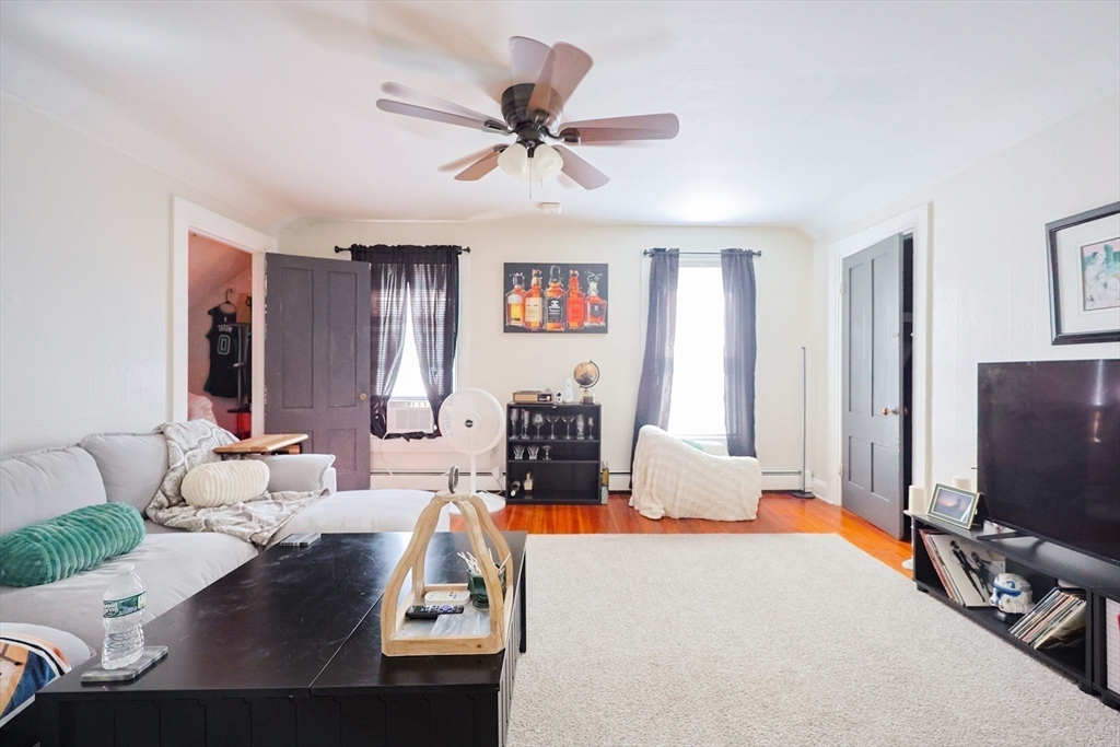 104 Grove Street Fall River, MA 02720 - Photo 23 of 37 a living room with furniture and a flat screen tv