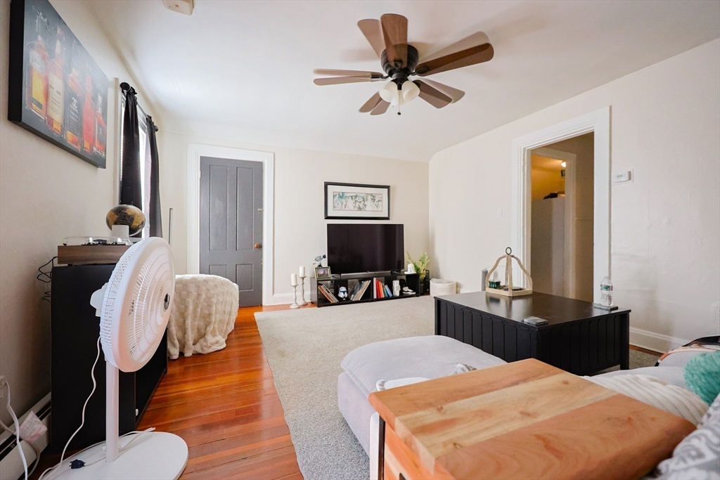 104 Grove Street Fall River, MA 02720 - Photo 25 of 37 a living room with furniture and a flat screen tv