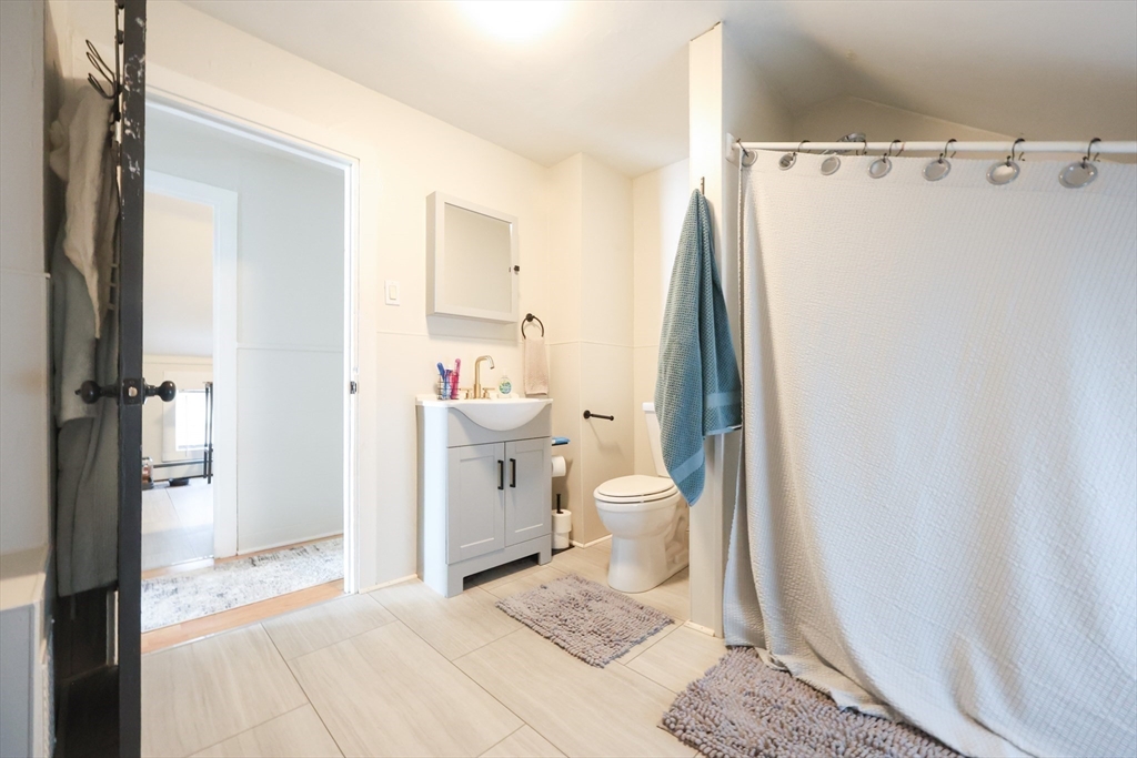 104 Grove Street Fall River, MA 02720 - Photo 28 of 37 a bathroom with a sink and a toilet