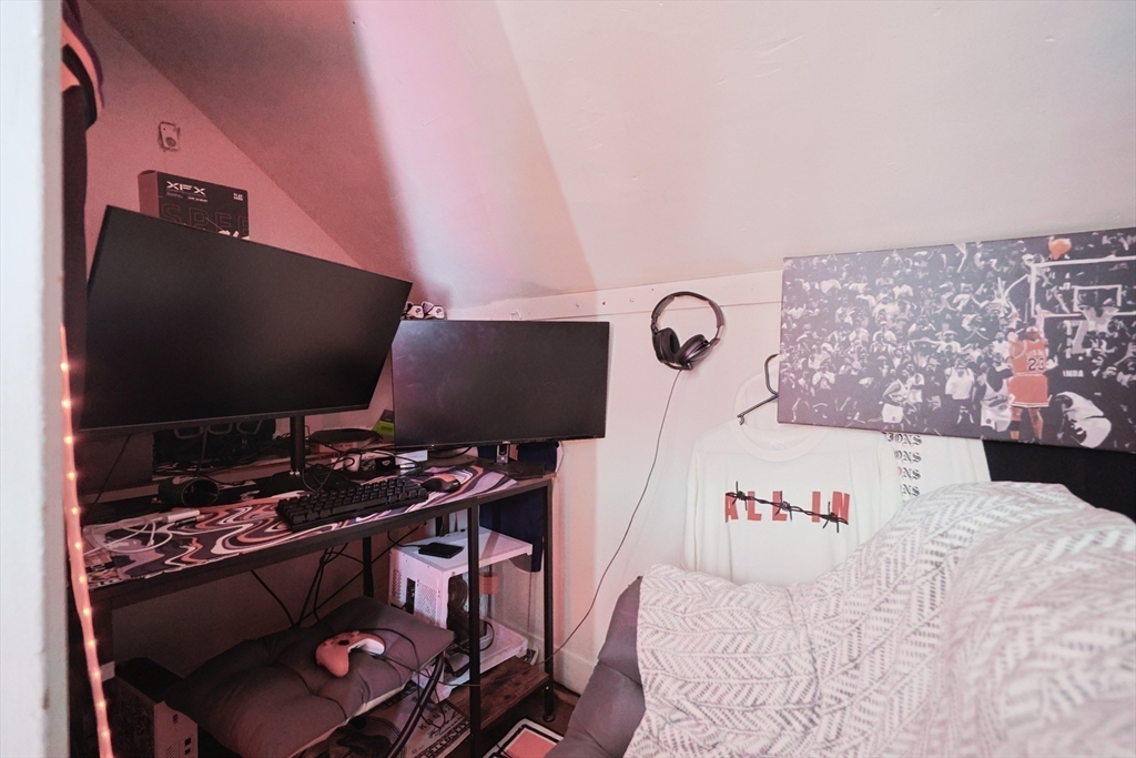 104 Grove Street Fall River, MA 02720 - Photo 30 of 37 a bedroom with a bed and a flat screen tv