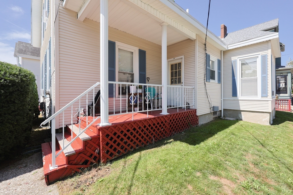 104 Grove Street Fall River, MA 02720 - Photo 35 of 37 a view of a bedroom with wooden deck and furniture