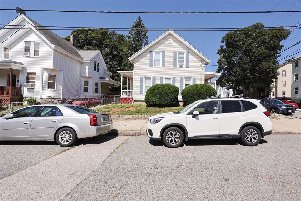 104 Grove Street Fall River, MA 02720 - Photo 36 of 37 a view of a car parked in front of a house