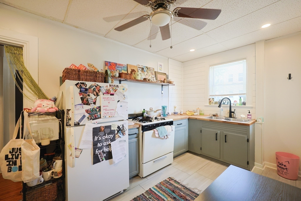 104 Grove Street Fall River, MA 02720 - Photo 7 of 37 a kitchen with stainless steel appliances granite countertop a sink and cabinets