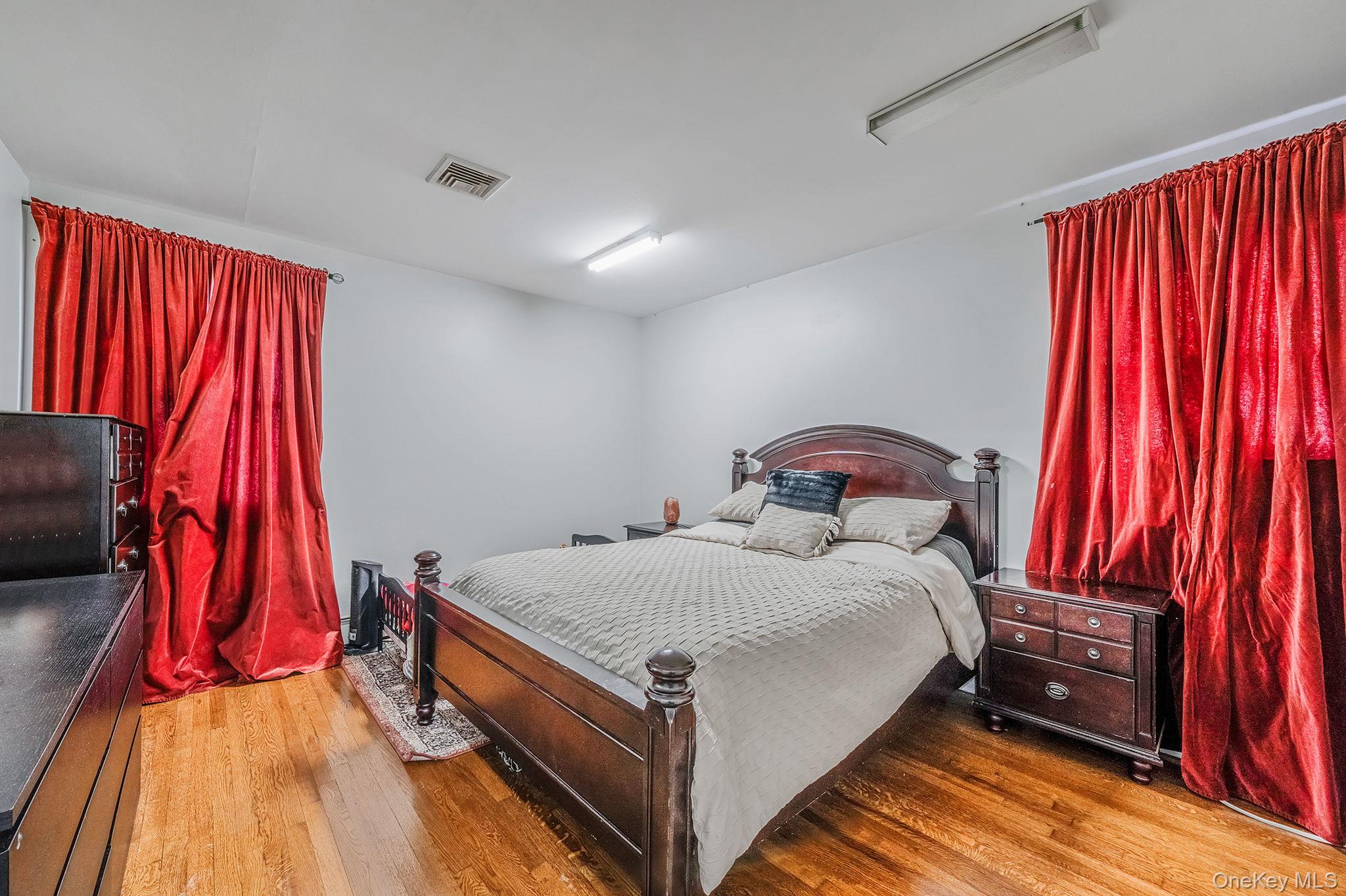 84-70 159th Street Queens, NY 11432 - Photo 16 of 50 Bedroom featuring light wood-style floors