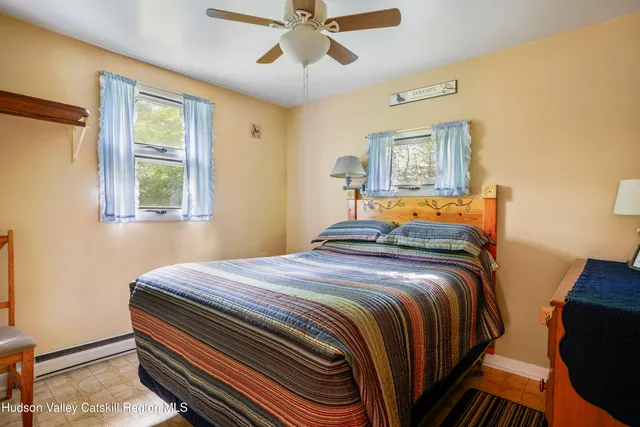 a bedroom with a bed and window