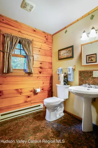 a white toilet sitting next to a bathroom sink