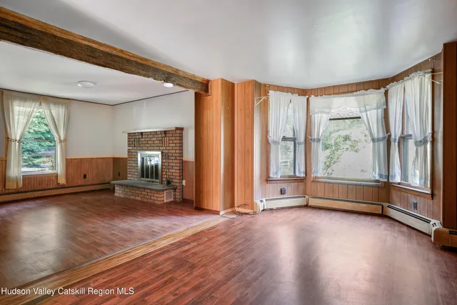 a view of room with window and hardwood