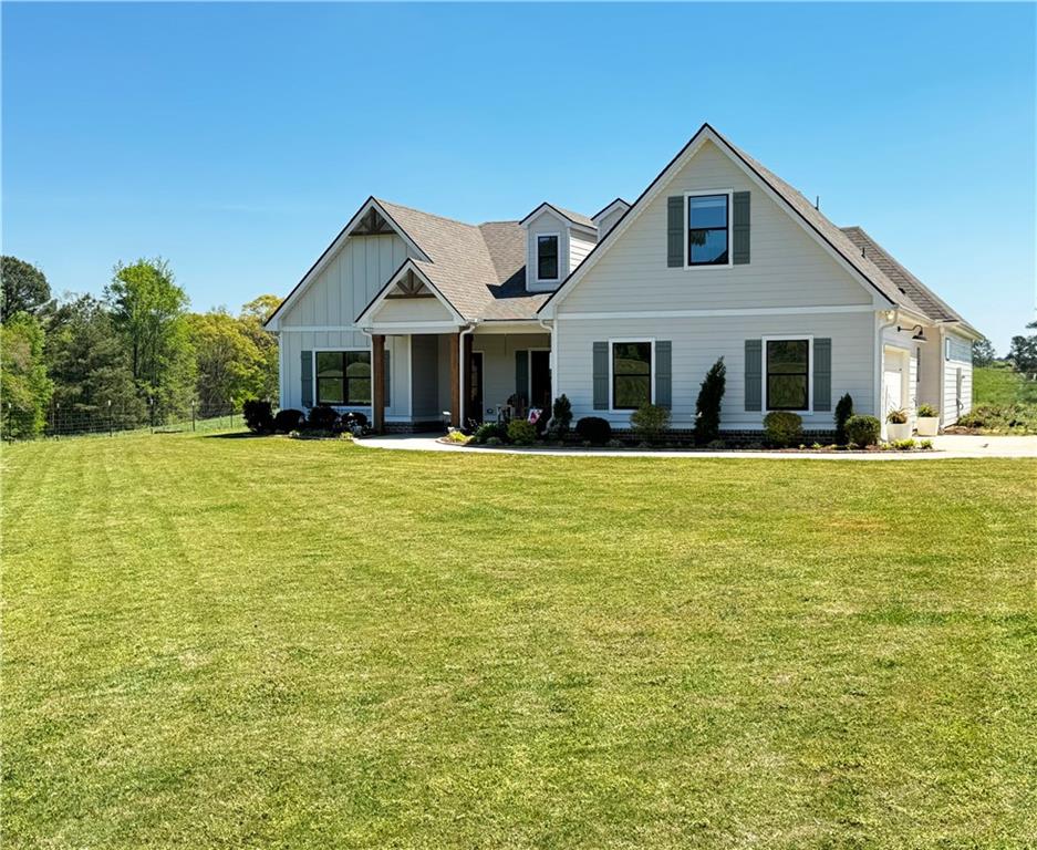 a front view of a house with a yard