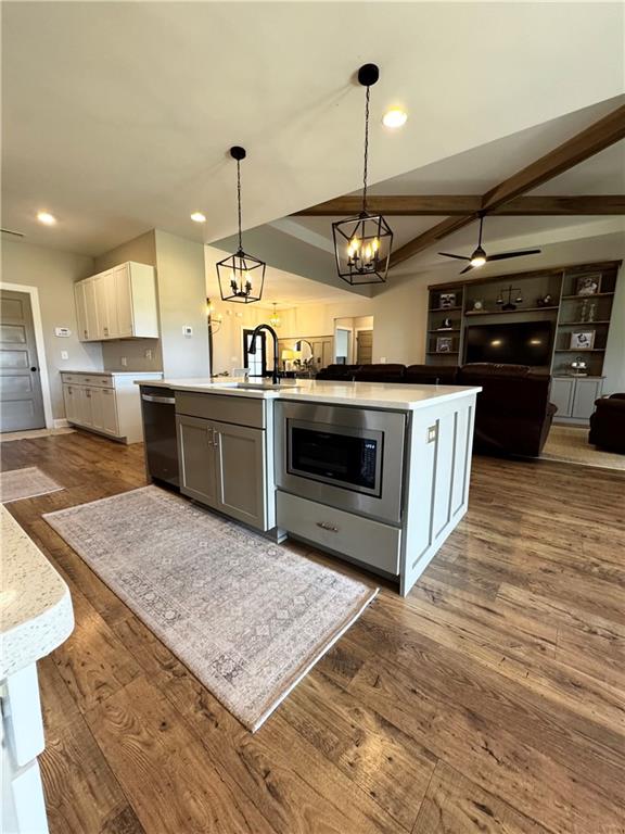 4515 Jacksonville Road Tallapoosa, GA 30176 - Photo 12 of 40 a kitchen with stainless steel appliances granite countertop a stove a sink and a wooden floors