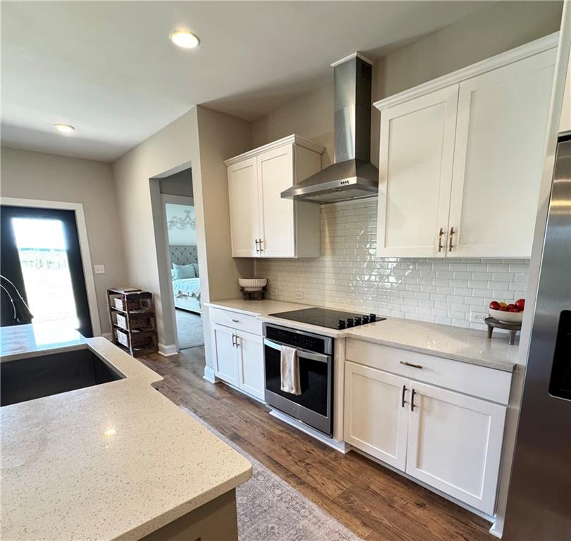 4515 Jacksonville Road Tallapoosa, GA 30176 - Photo 13 of 40 a kitchen with white cabinets and appliances