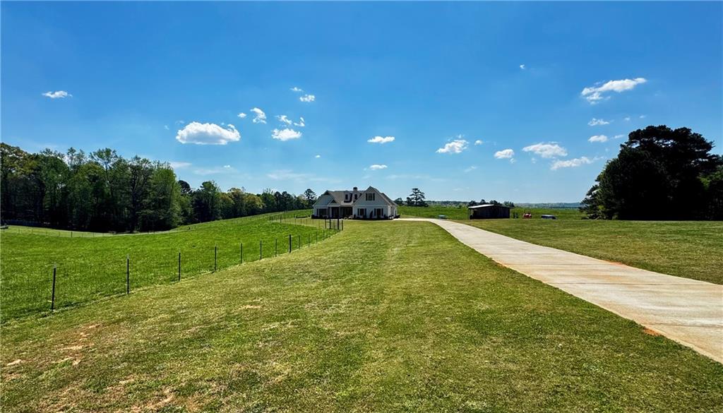 4515 Jacksonville Road Tallapoosa, GA 30176 - Photo 2 of 40 a view of a golf course with a lake