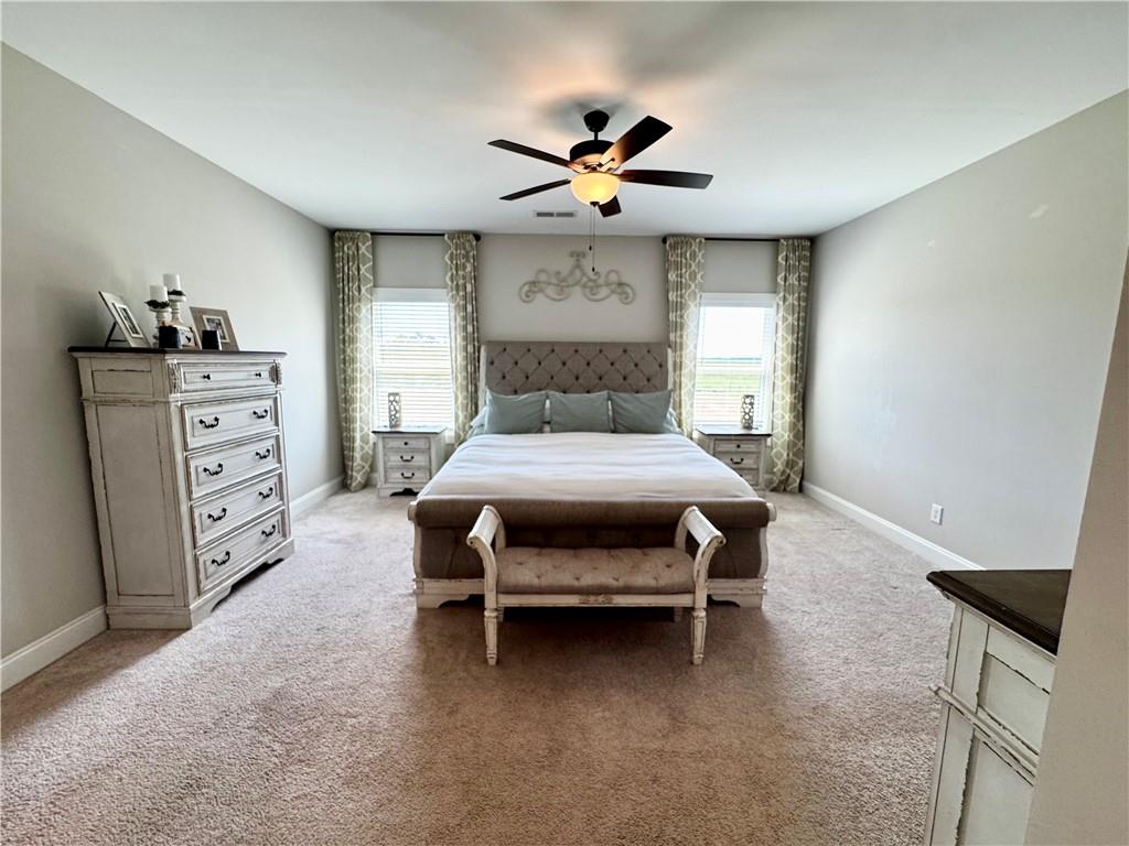 4515 Jacksonville Road Tallapoosa, GA 30176 - Photo 24 of 40 a bedroom with a bed and a chandelier