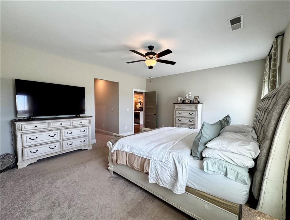 4515 Jacksonville Road Tallapoosa, GA 30176 - Photo 25 of 40 a bedroom with a bed and a flat screen tv