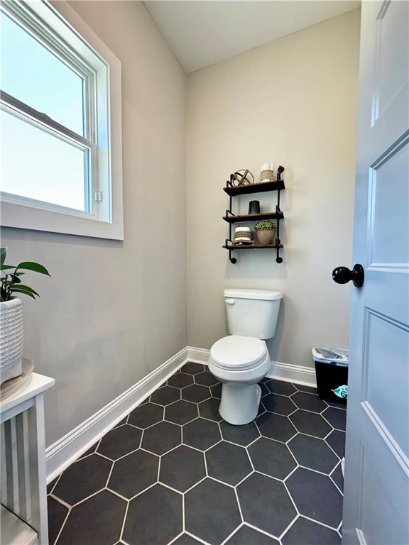 4515 Jacksonville Road Tallapoosa, GA 30176 - Photo 28 of 40 a bathroom with a toilet and a sink
