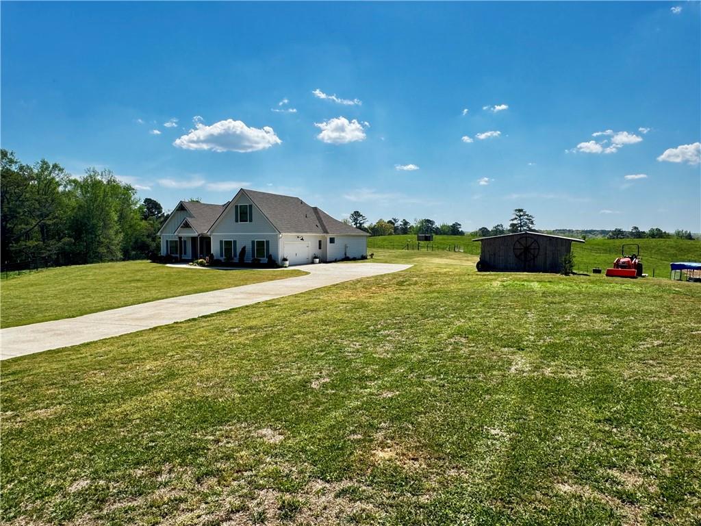 4515 Jacksonville Road Tallapoosa, GA 30176 - Photo 3 of 40 a view of a patio with a yard