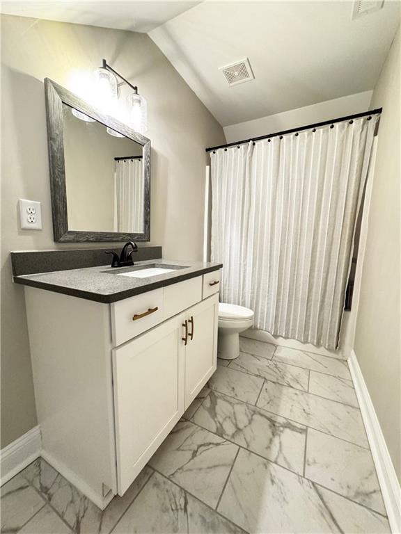 4515 Jacksonville Road Tallapoosa, GA 30176 - Photo 32 of 40 a spacious bathroom with a granite countertop sink and a mirror