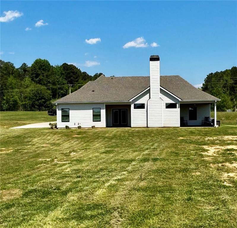 4515 Jacksonville Road Tallapoosa, GA 30176 - Photo 33 of 40 a front view of a house with a garden