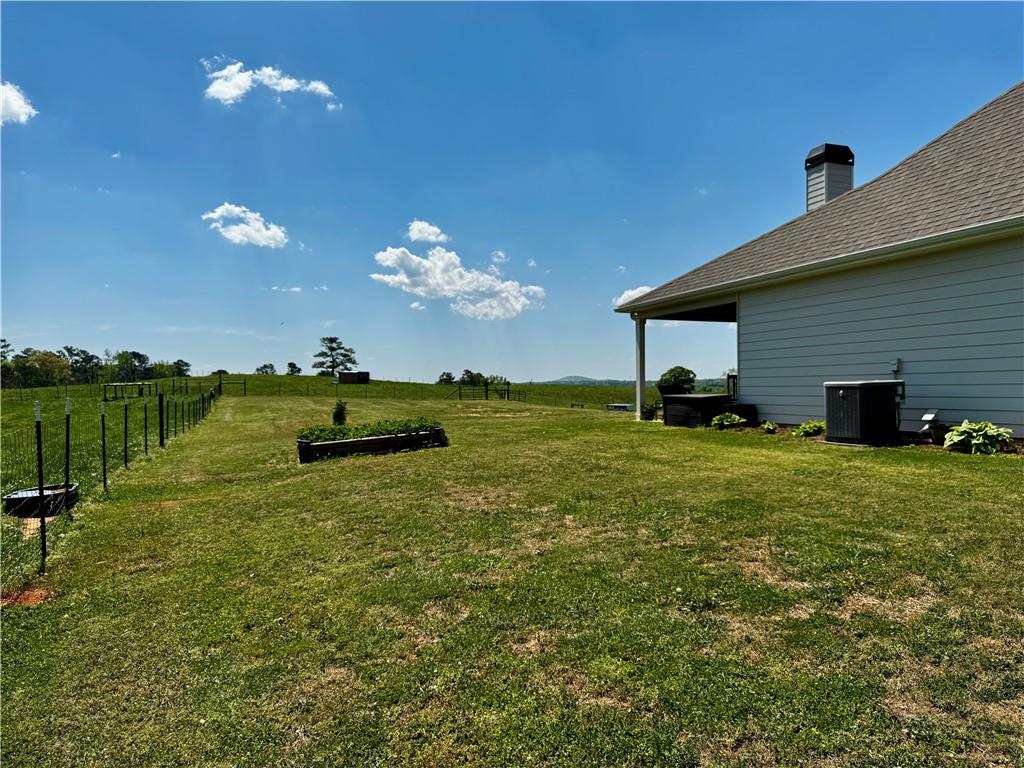 4515 Jacksonville Road Tallapoosa, GA 30176 - Photo 4 of 40 a view of a house with a big yard