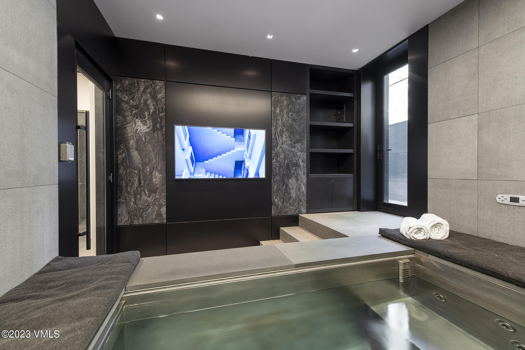 463 Beaver Dam Road Vail, CO 81657 - Photo 17 of 21 a bedroom with a bed and a flat screen tv