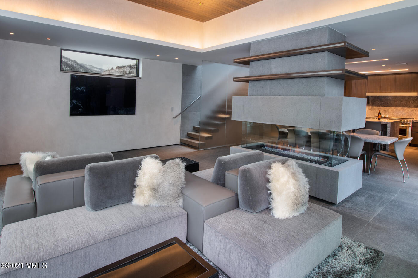 463 Beaver Dam Road Vail, CO 81657 - Photo 5 of 21 a living room with furniture and a flat screen tv