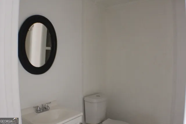 a bathroom with a toilet and a sink