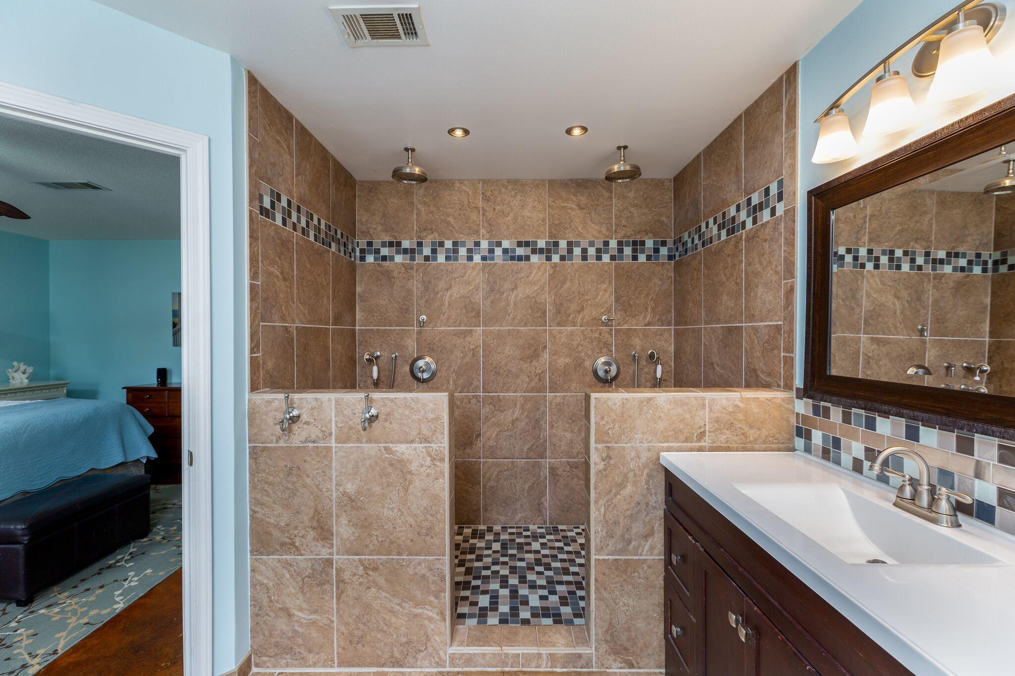 7780 Fenwick Street Navarre, FL 32566 - Photo 14 of 31 a bathroom with a sink a toilet and shower