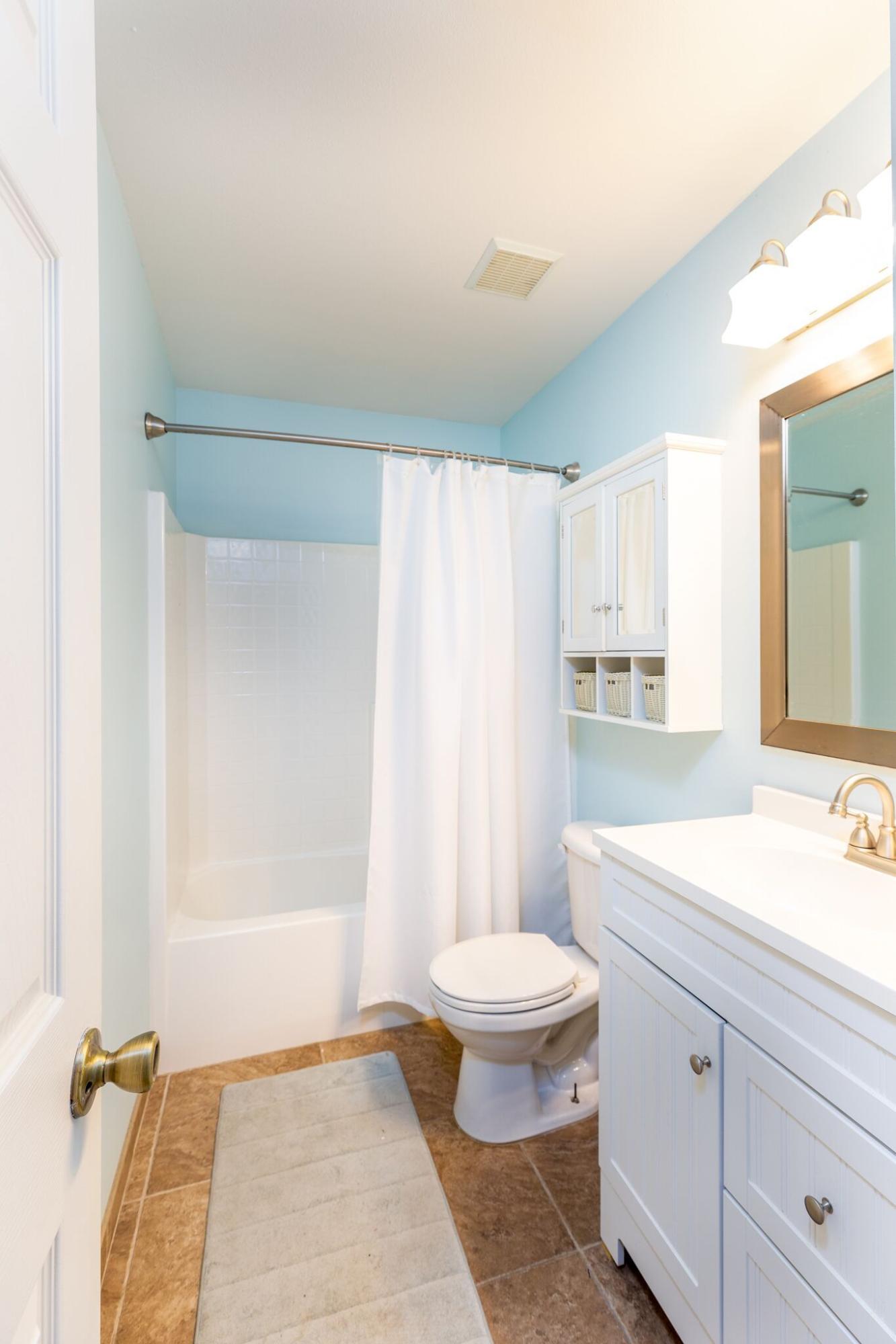 7780 Fenwick Street Navarre, FL 32566 - Photo 17 of 31 a bathroom with a sink toilet and shower