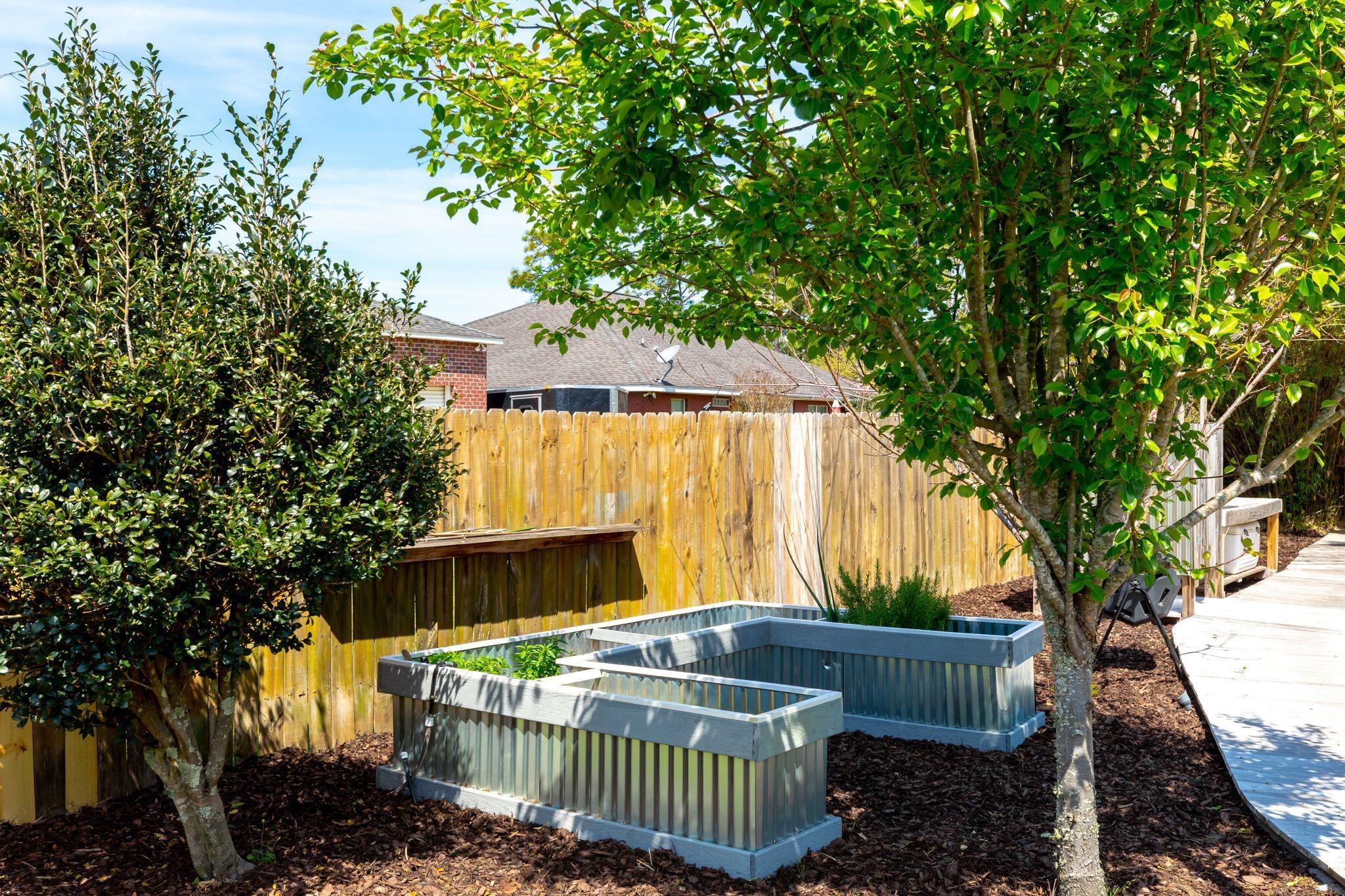 7780 Fenwick Street Navarre, FL 32566 - Photo 26 of 31 a view of a house with a small park