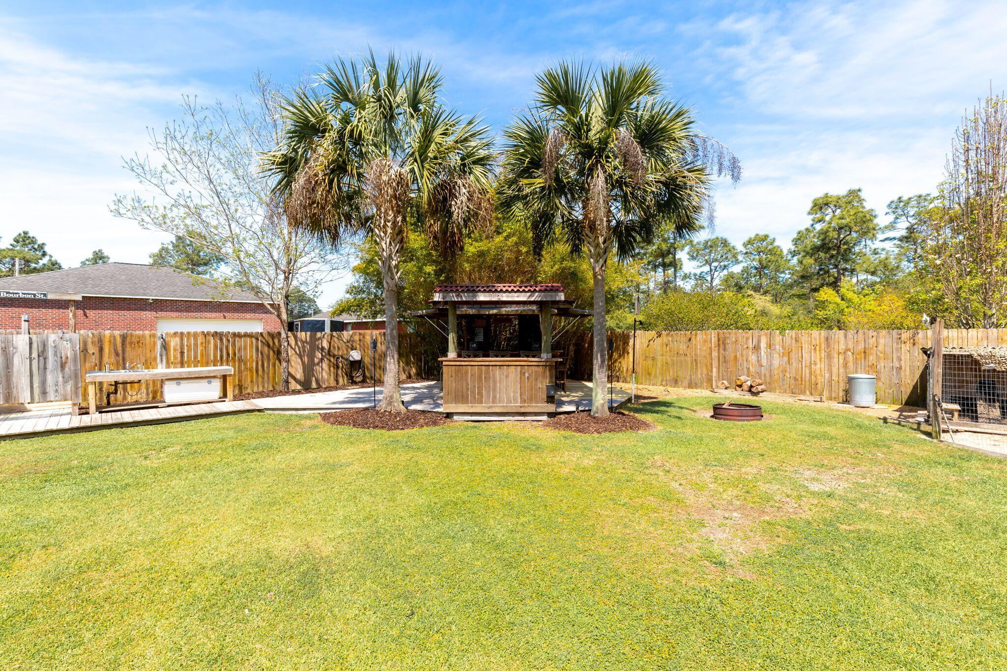7780 Fenwick Street Navarre, FL 32566 - Photo 28 of 31 a view of a swimming pool with lounge chairs