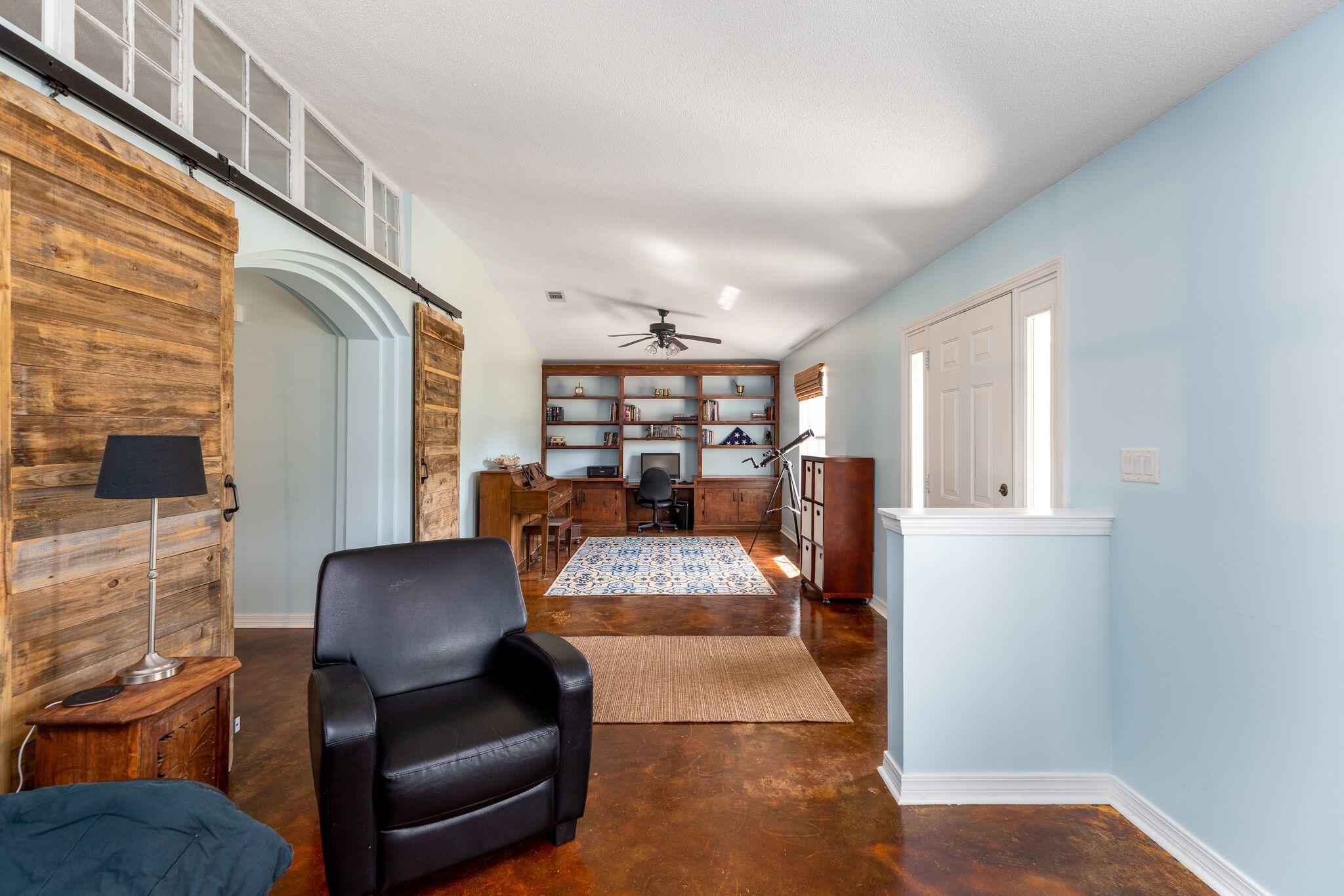 7780 Fenwick Street Navarre, FL 32566 - Photo 4 of 31 a view of a hallway with furniture and window