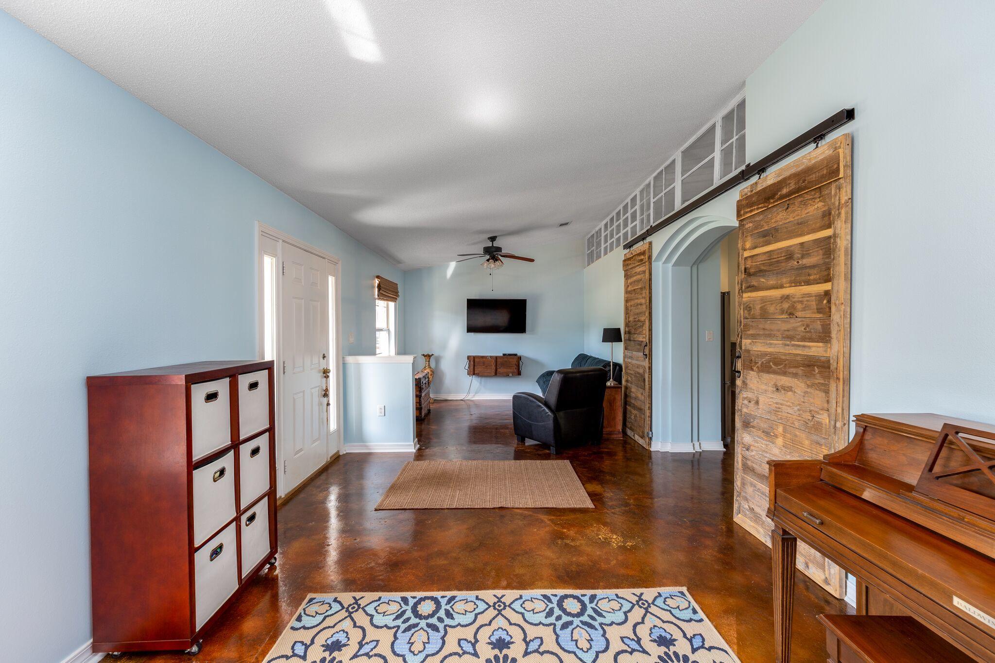 7780 Fenwick Street Navarre, FL 32566 - Photo 5 of 31 a living room with furniture