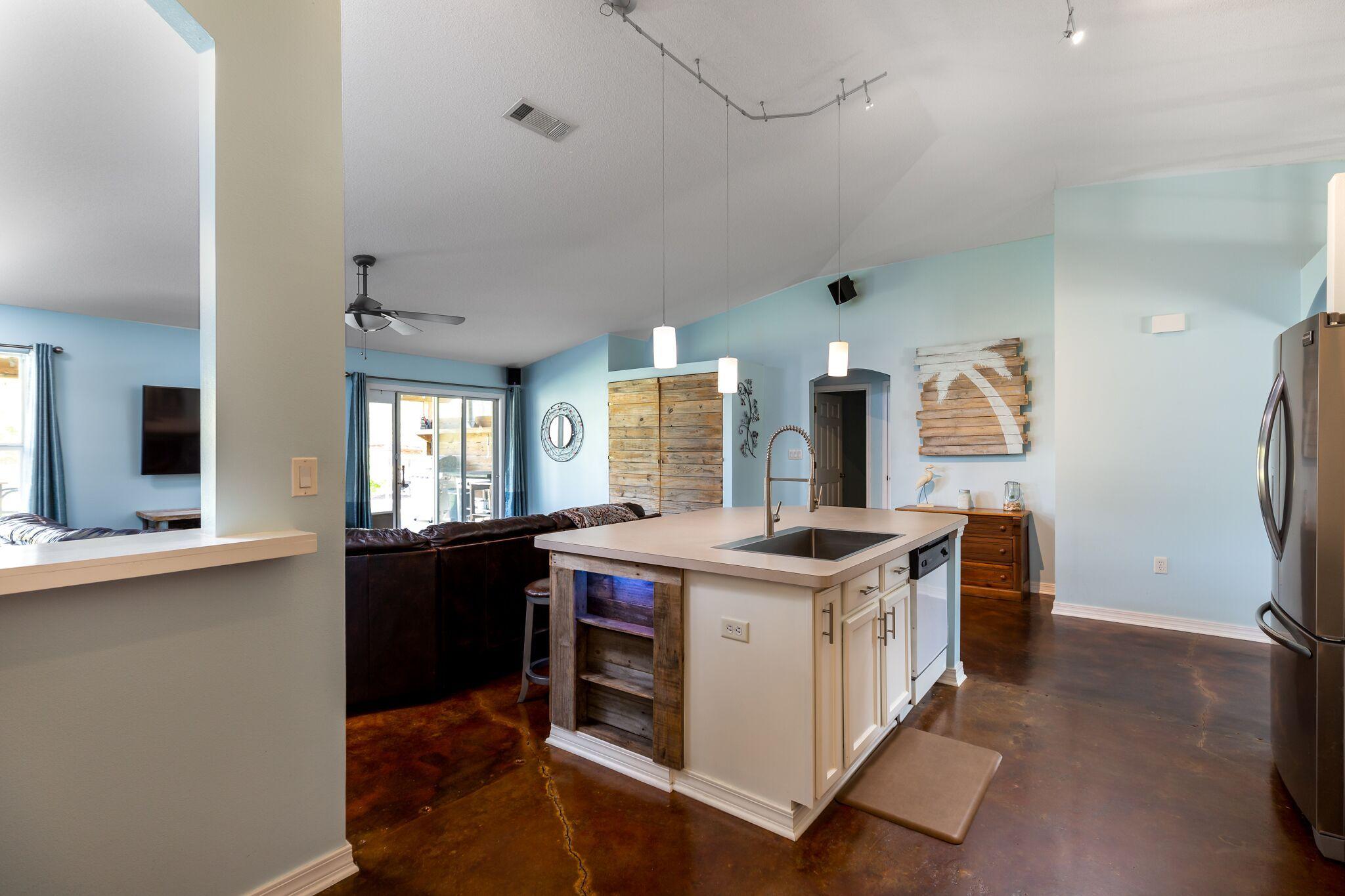 7780 Fenwick Street Navarre, FL 32566 - Photo 8 of 31 a open kitchen with stainless steel appliances granite countertop a stove and cabinets