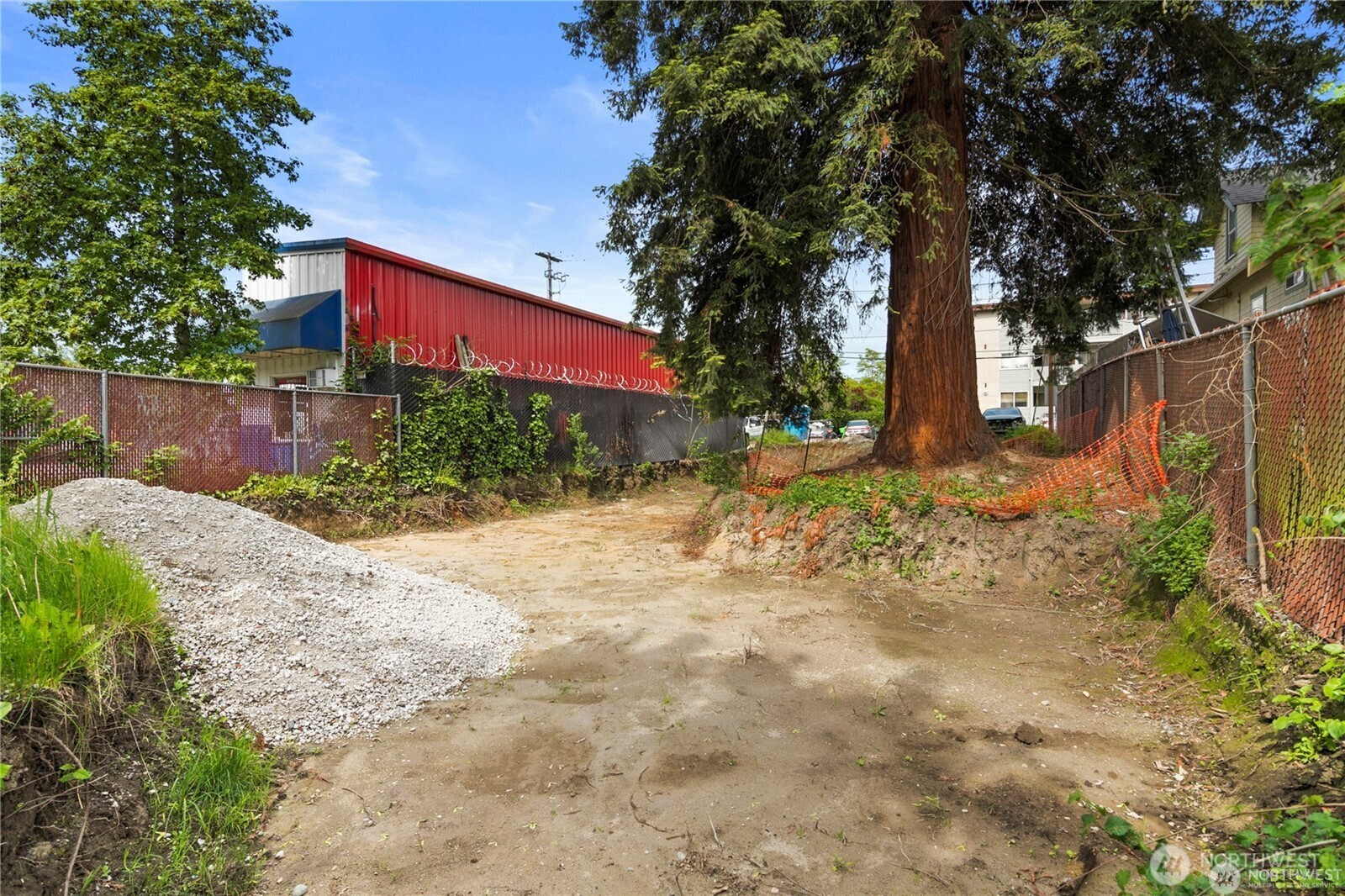 3219 Claremont Avenue South Seattle, WA 98144 - Photo 6 of 10 a front view of a house with a yard and covered with trees
