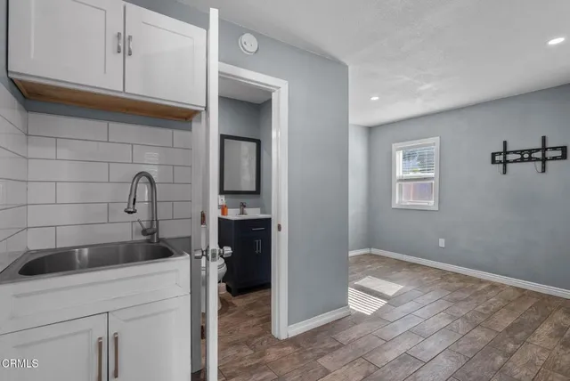 a kitchen with a sink and cabinets
