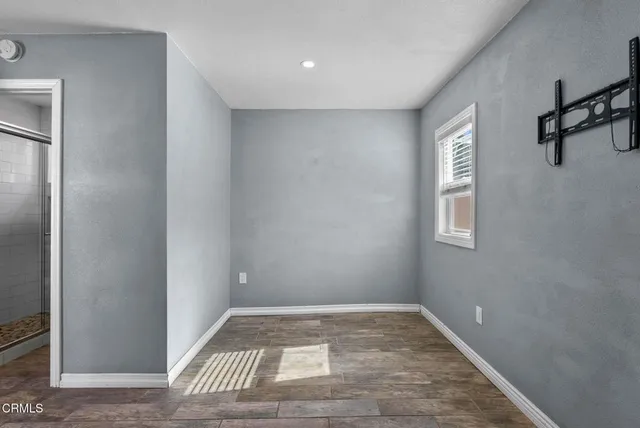 a view of an empty room and window