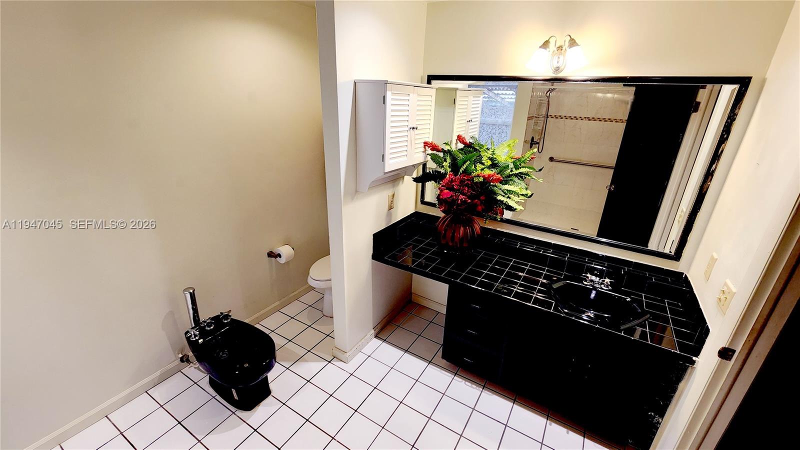 15151 Southwest 166th Street Miami, FL 33187 - Photo 15 of 37 a potted plant sitting on a wooden floor