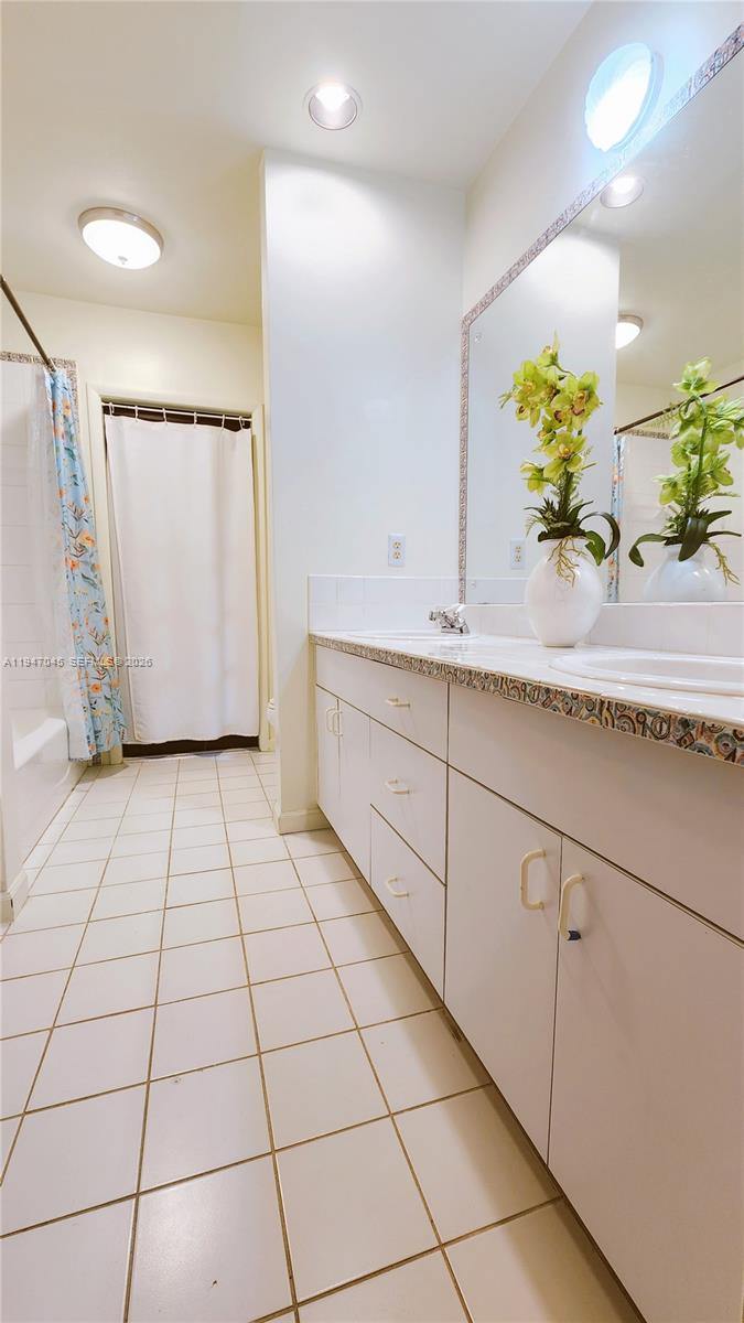 15151 Southwest 166th Street Miami, FL 33187 - Photo 20 of 37 a view of a kitchen with cabinets and wooden floor