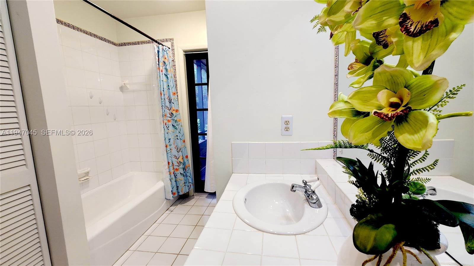 15151 Southwest 166th Street Miami, FL 33187 - Photo 23 of 37 a bath room with a bathtub and a shower