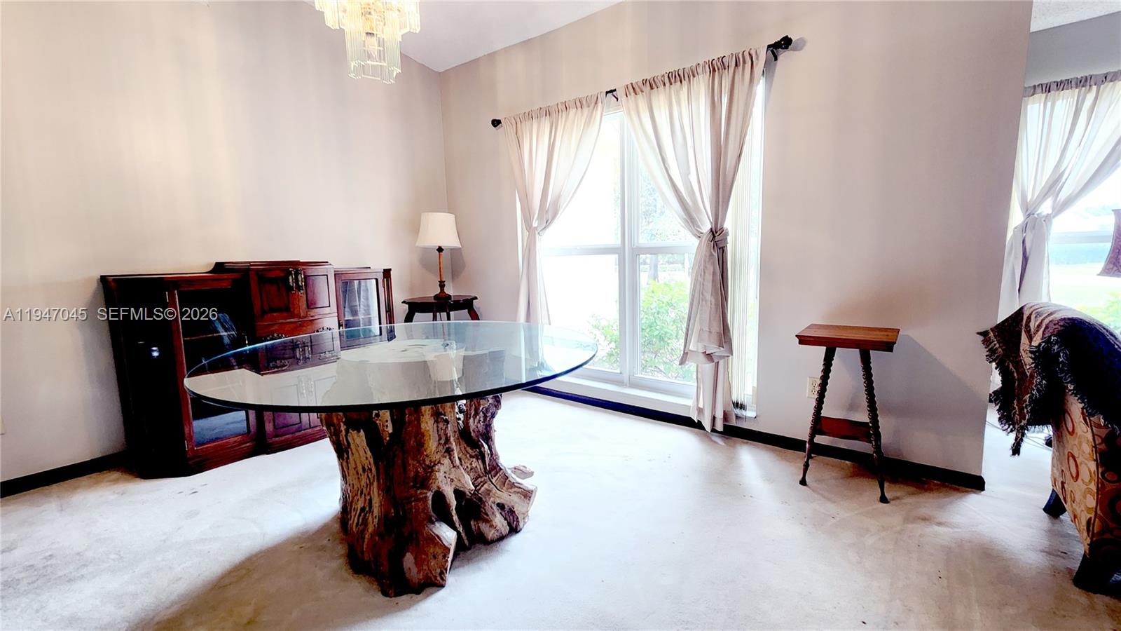 15151 Southwest 166th Street Miami, FL 33187 - Photo 26 of 37 a dining room with furniture and window