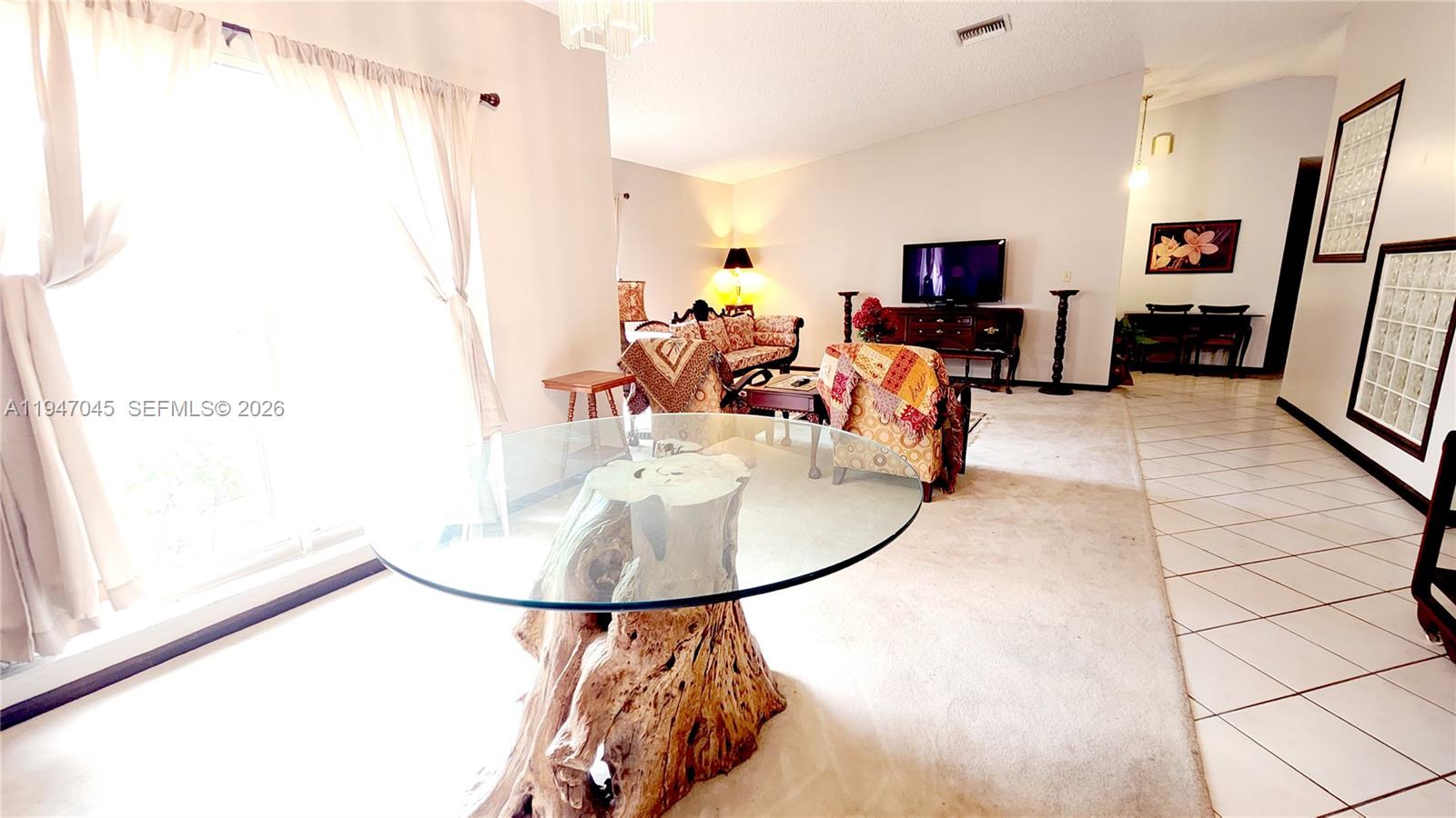 15151 Southwest 166th Street Miami, FL 33187 - Photo 27 of 37 a view of a living room with furniture