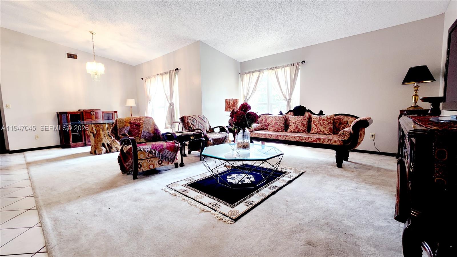 15151 Southwest 166th Street Miami, FL 33187 - Photo 30 of 37 a living room with furniture and a large window