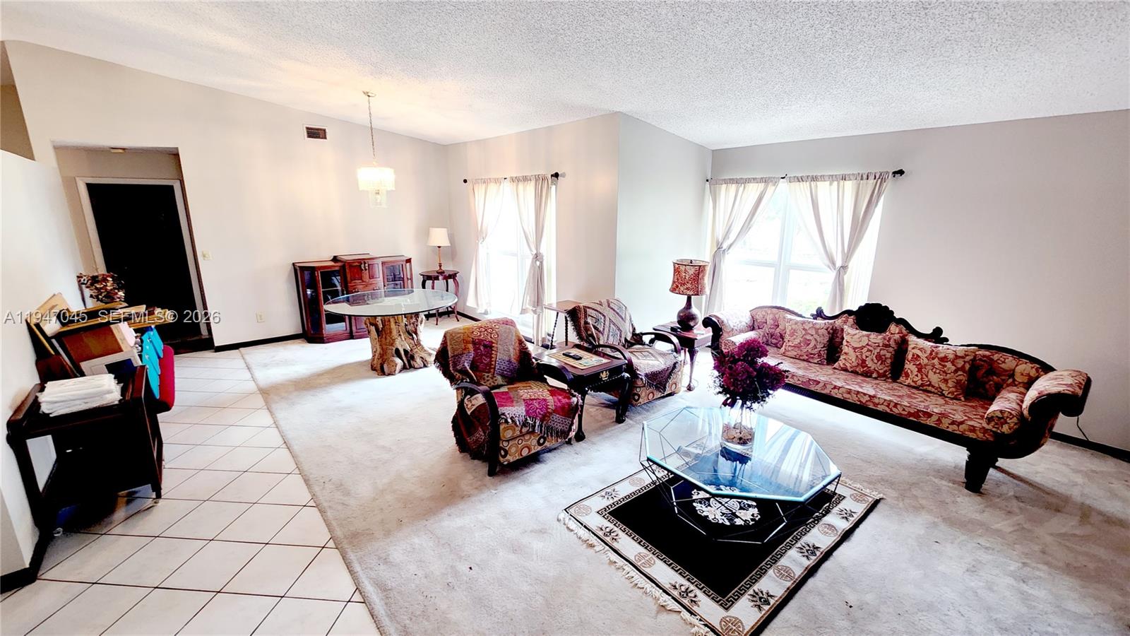 15151 Southwest 166th Street Miami, FL 33187 - Photo 31 of 37 a living room with furniture and a flat screen tv