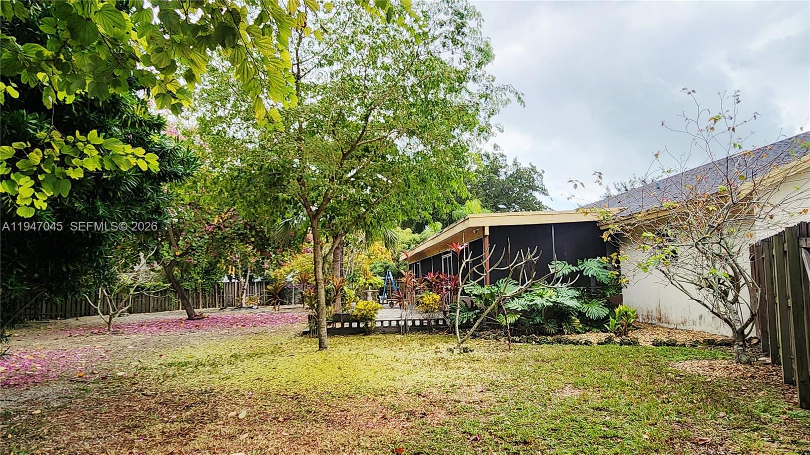 15151 Southwest 166th Street Miami, FL 33187 - Photo 36 of 37 a view of a house with backyard and sitting area