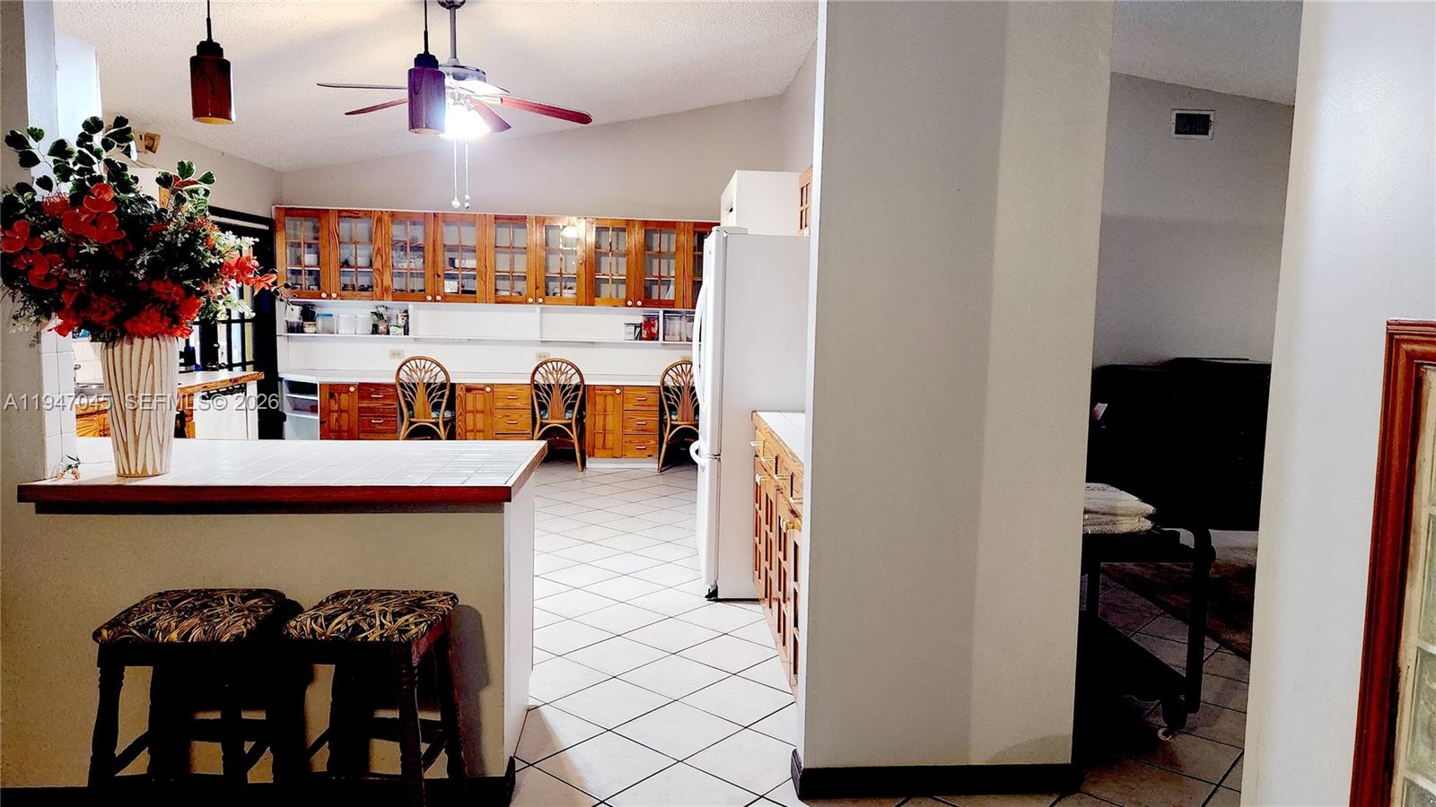 15151 Southwest 166th Street Miami, FL 33187 - Photo 5 of 37 a view of living room with furniture and a fireplace