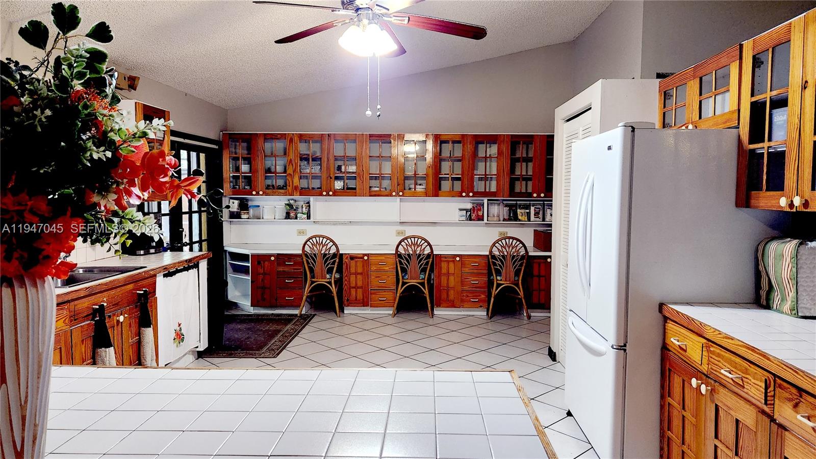 15151 Southwest 166th Street Miami, FL 33187 - Photo 8 of 37 a view of a room with racks games and windows