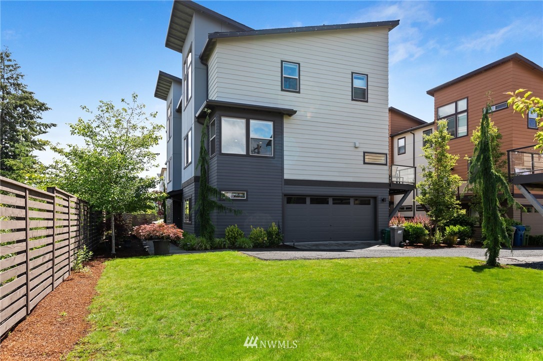 4514 Northeast 3rd Lane Renton, WA 98059 - Photo 1 of 22 a front view of a house with a yard and a garage